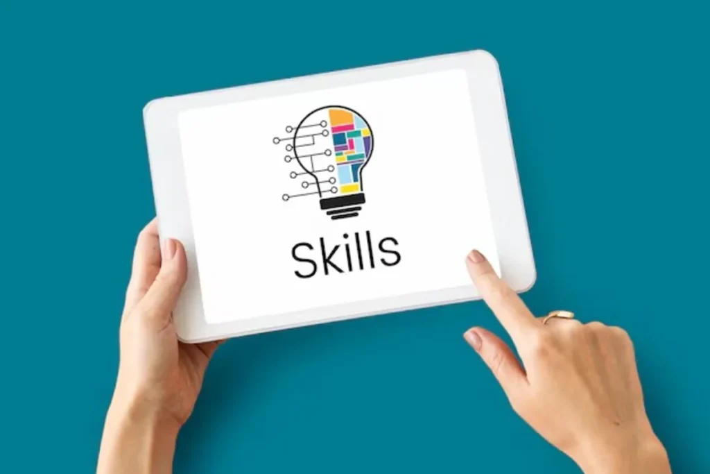 Hands holding a tablet that displays a graphic of a lightbulb made of digital circuits and colorful shapes, with the word 'Skills' written below it.